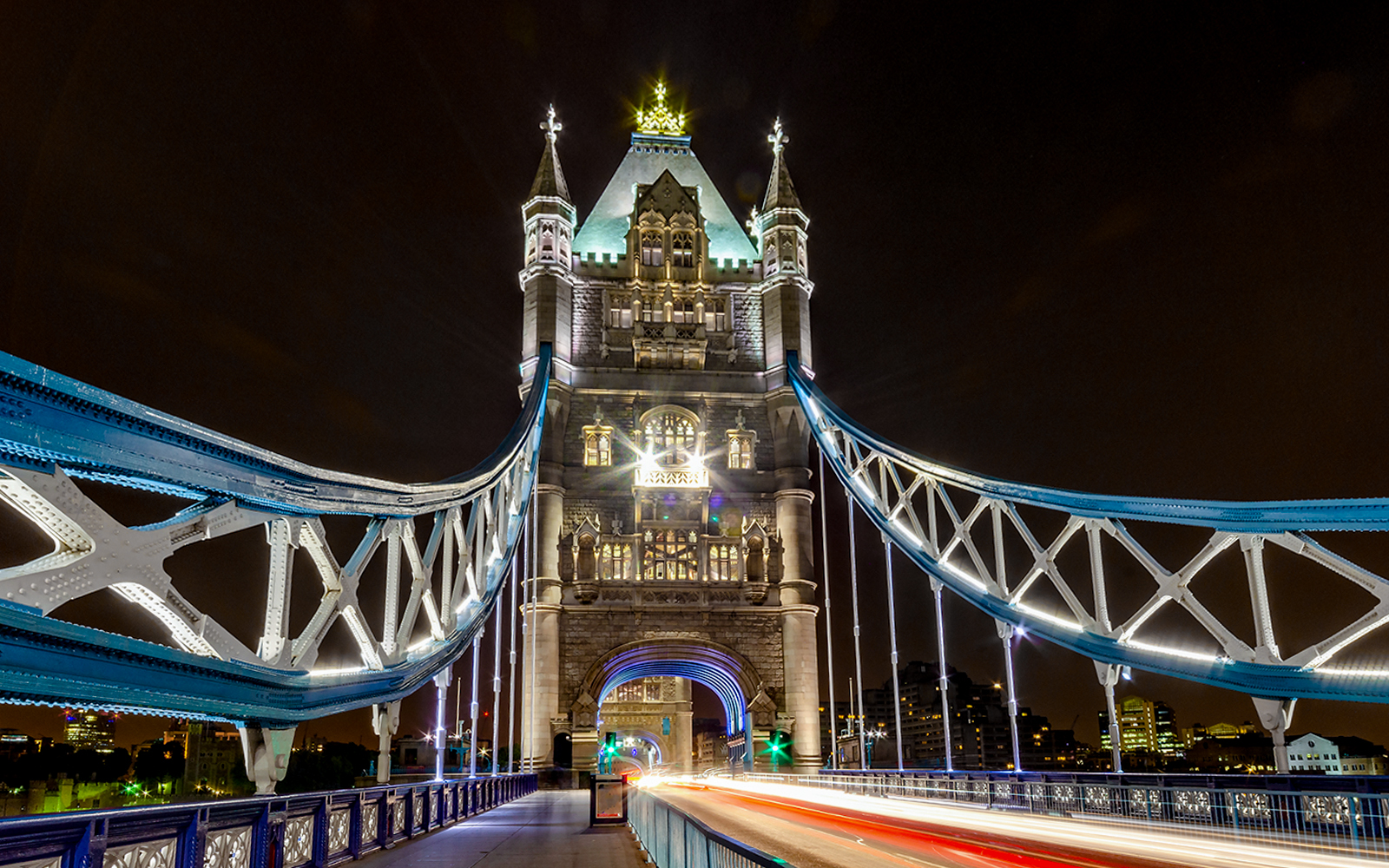 Tower Bridge in London illuminated at night during Christmas.