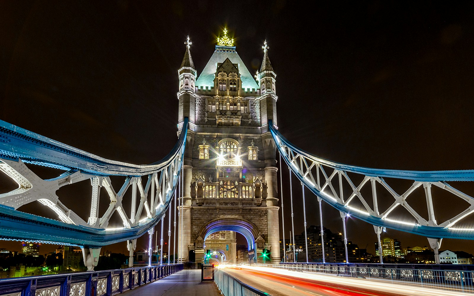 Tower Bridge in London illuminated at night during Christmas.