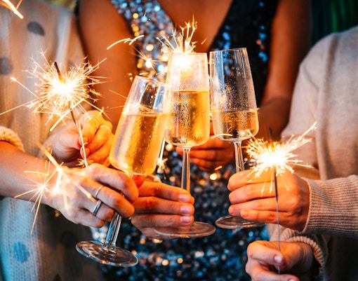 Champagne toasts and sparklers at New Year celebration in Melbourne's Alexandra Gardens.