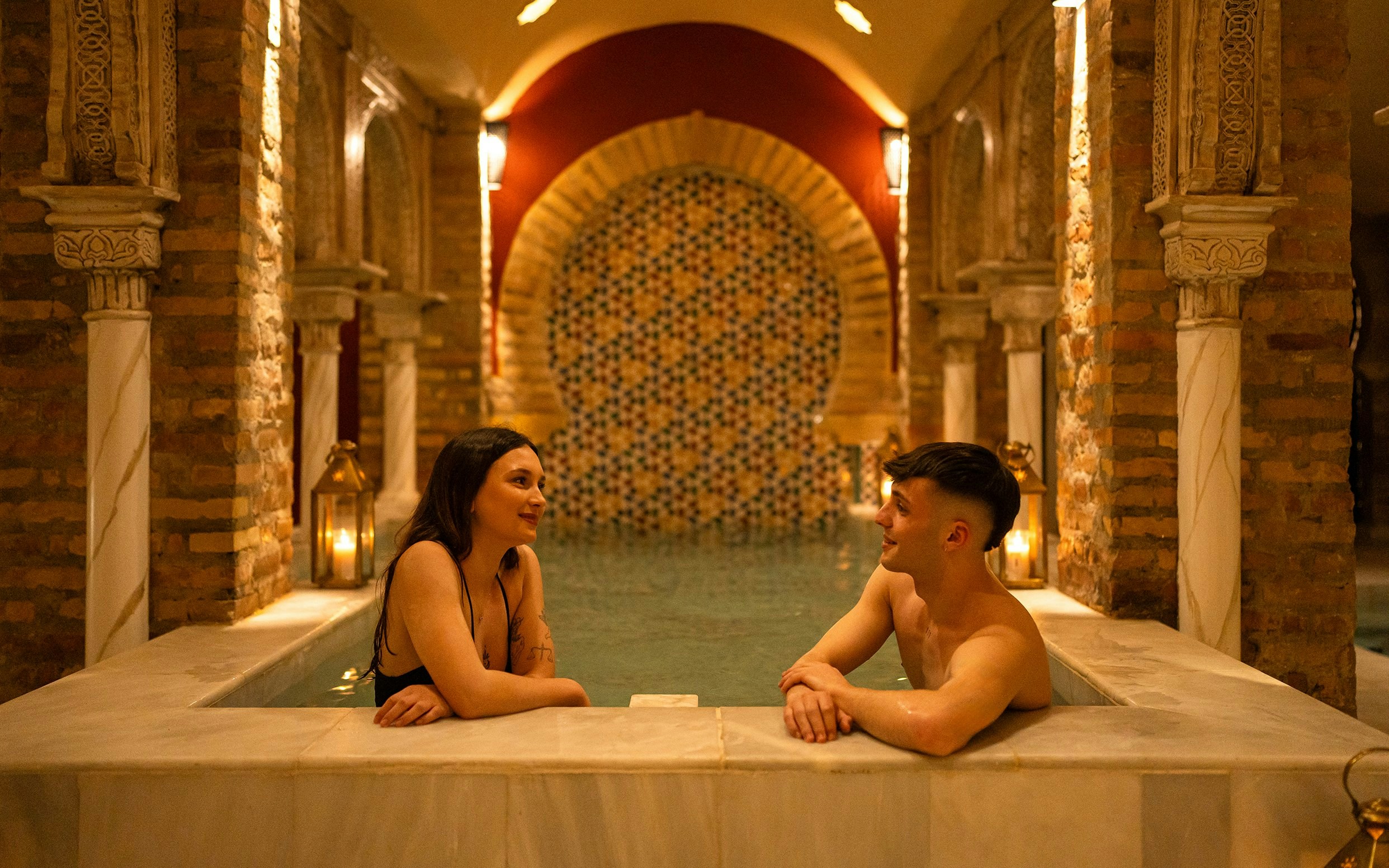 Couple enjoying a traditional Hammam bath in Granada.