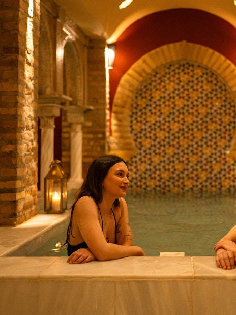 Couple enjoying a traditional Hammam bath in Granada.
