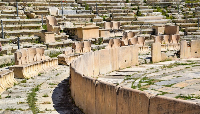 Marble seats in the first row of the Theatre of Dionysus at the Acropolis, Athens, Greece.