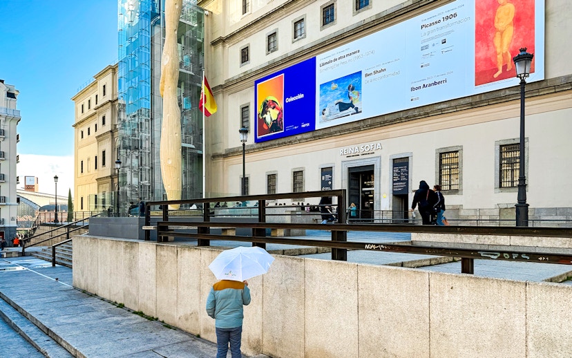 Reina Sofia Museum entrance with visitors in Madrid, Spain.