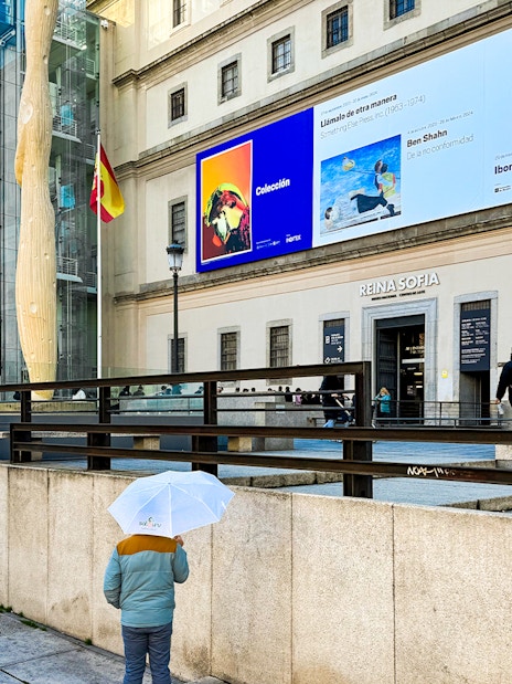 Reina Sofia Museum entrance with visitors in Madrid, Spain.