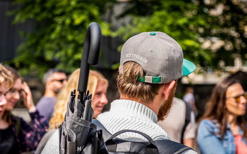Group of tourists on Edinburgh Harry Potter walking tour near Edinburgh Castle.