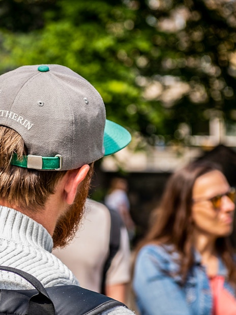 Group of tourists on Edinburgh Harry Potter walking tour near Edinburgh Castle.