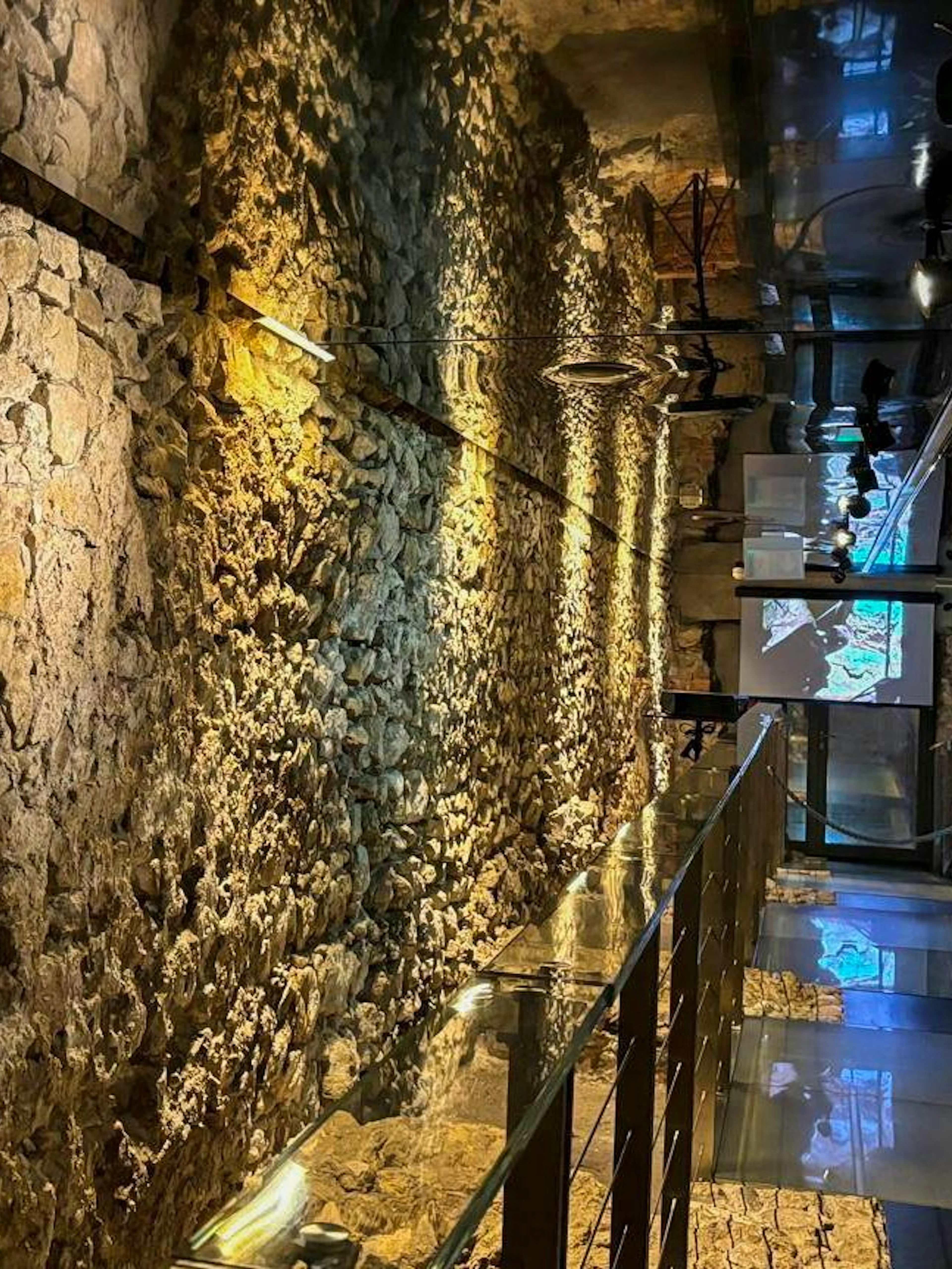 Rynek Underground Museum stone walls and illuminated walkway in Krakow.