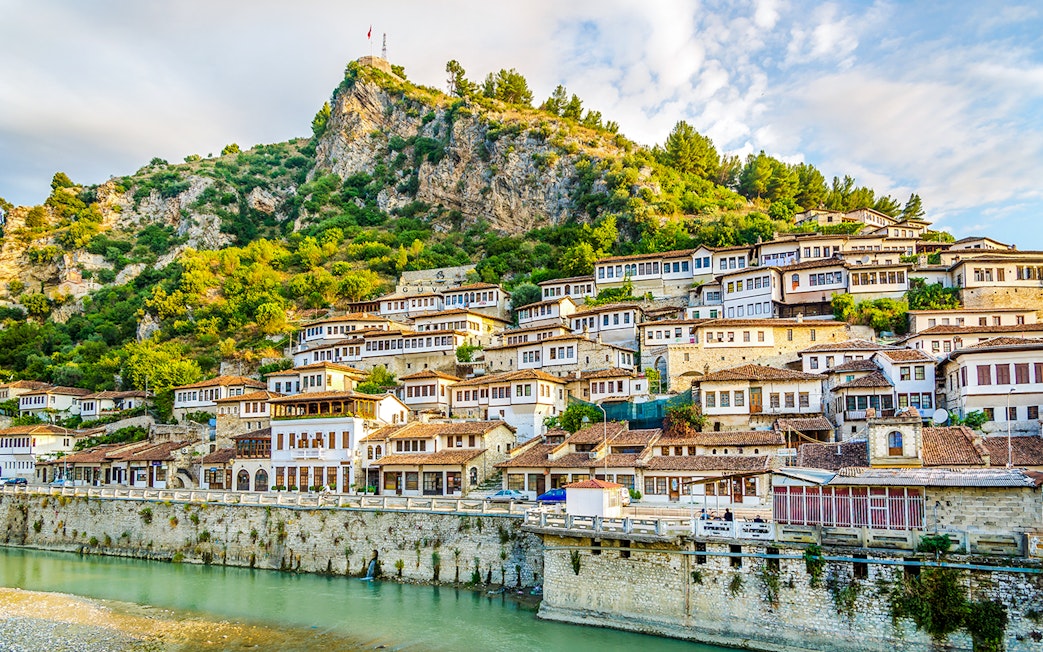 Old city of Berat with traditional white Ottoman houses on hillside.