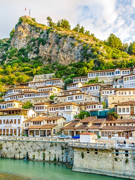 Old city of Berat with traditional white Ottoman houses on hillside.