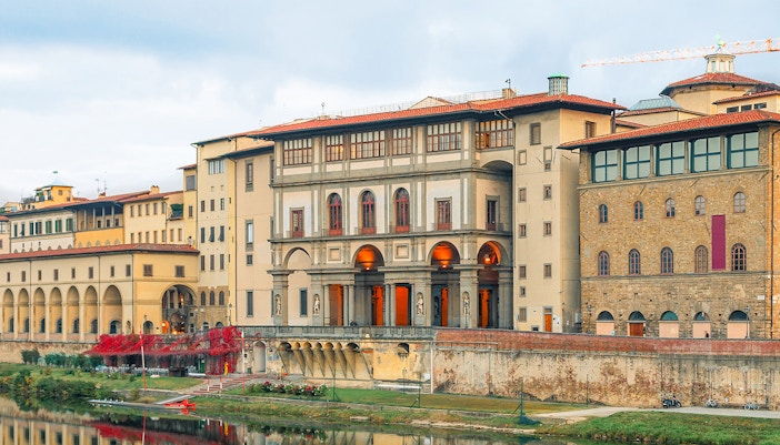 Vasari Corridor spanning the Arno River with Uffizi Gallery entrance in Florence, Italy.