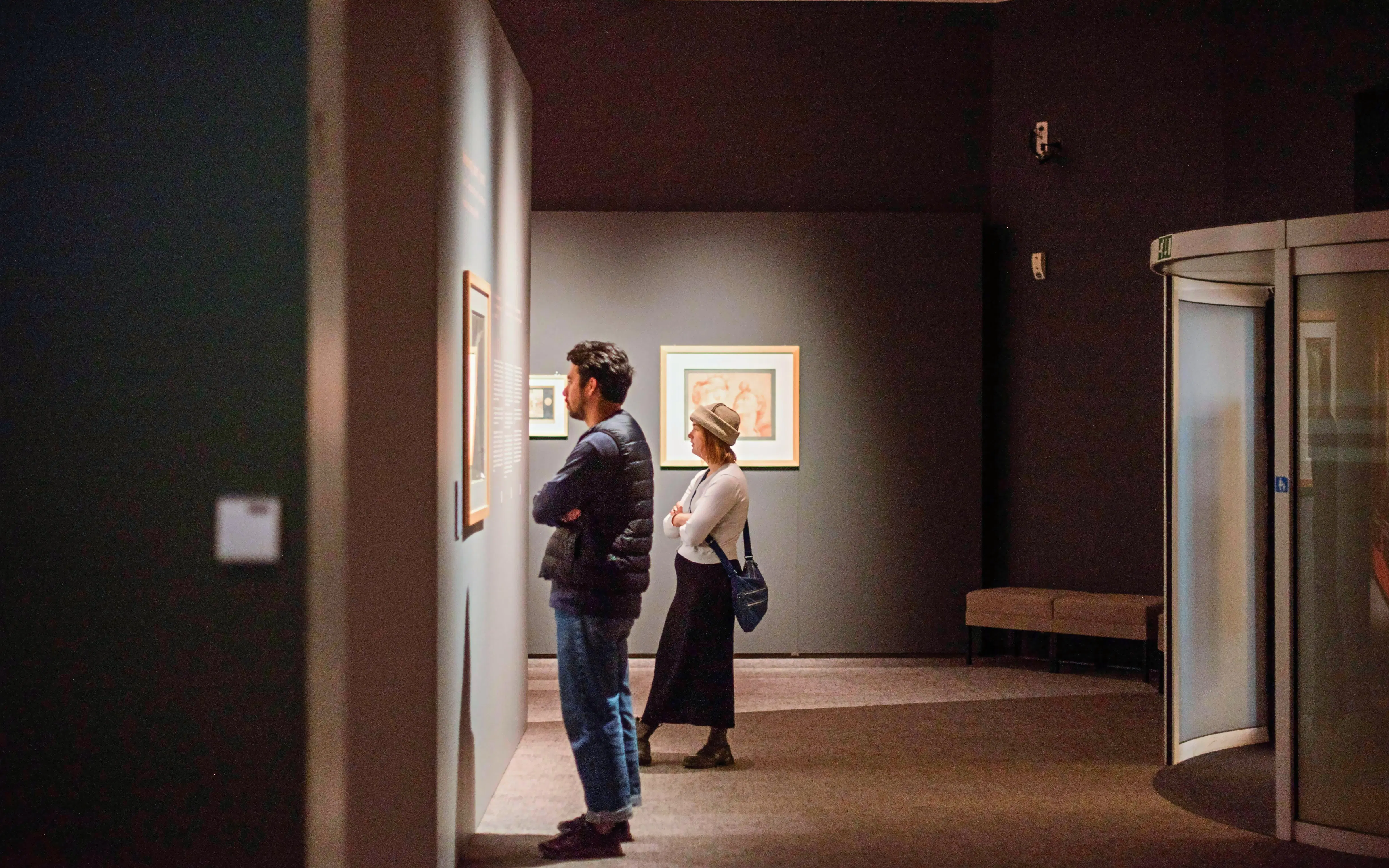 Visitors viewing art at Groeningemuseum, Bruges.