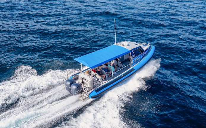 Boat cruising on Lake Macquarie, Australia with passengers onboard.