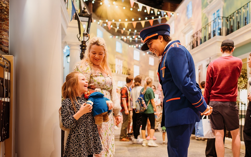 Guests interacting with a Paddington character at the Paddington Experience.