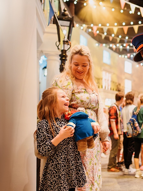 Guests interacting with a Paddington character at the Paddington Experience.
