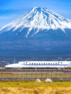 High-speed train passing Mount Fuji on Japan Rail Pass route, Tokyo.