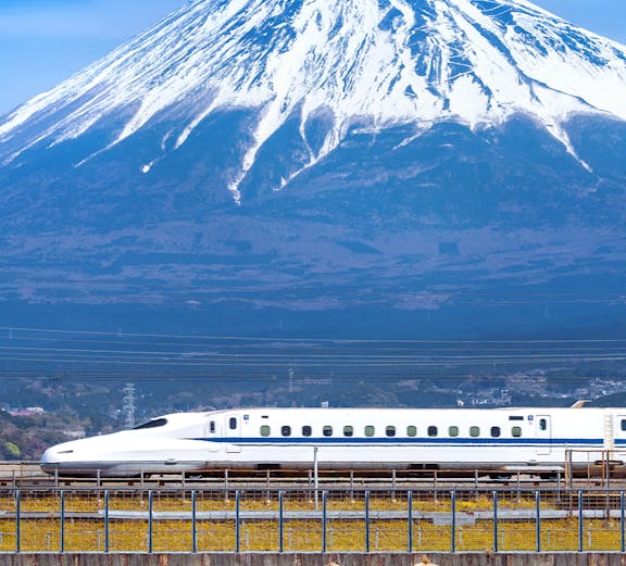 High-speed train passing Mount Fuji on Japan Rail Pass route, Tokyo.