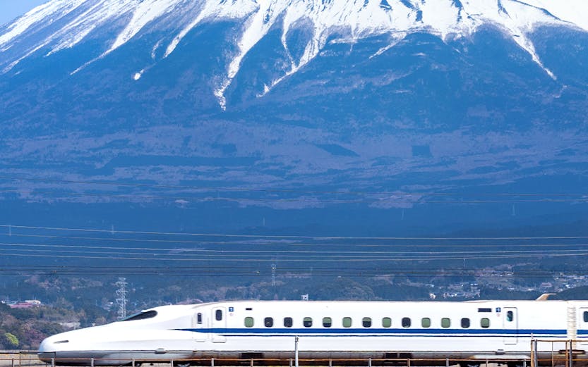 High-speed train passing Mount Fuji on Japan Rail Pass route, Tokyo.