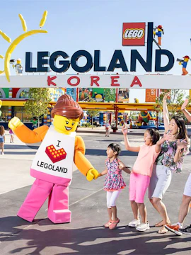 Family enjoying with Lego character at Legoland Korea Resort entrance.