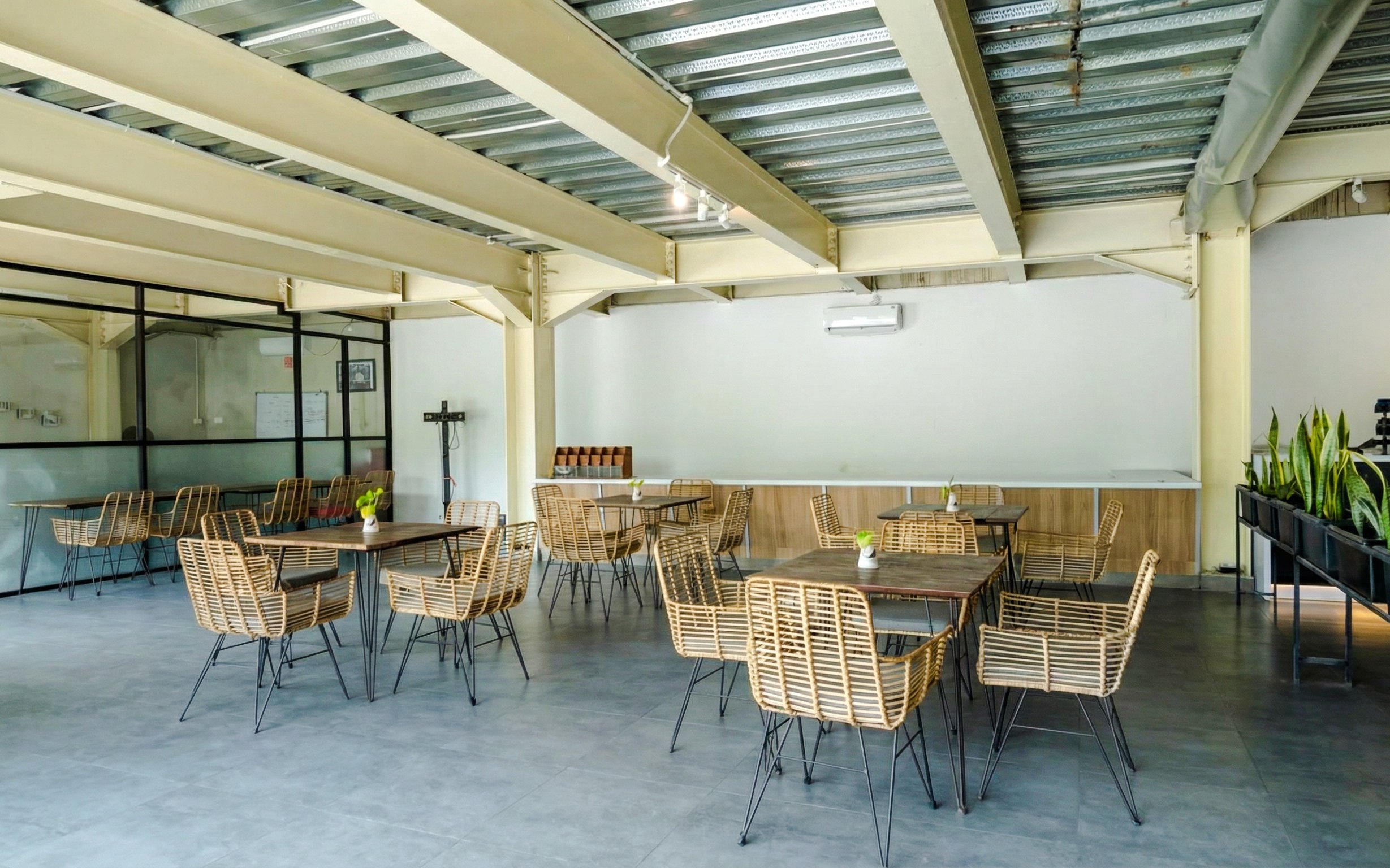 Dining area with wicker chairs at Bali Exotic Marine Park.