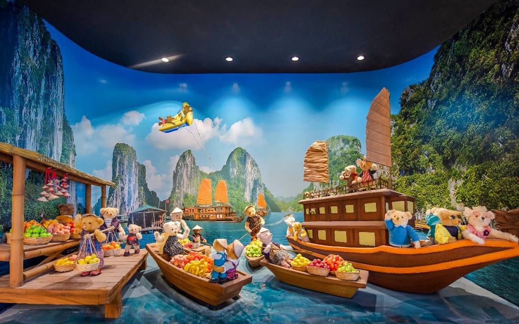 Teddy bears on boats in a scenic display at Teddy Bear Museum.