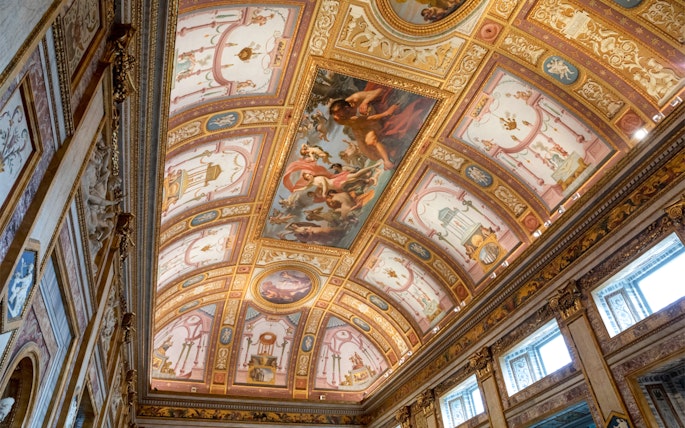 Frescoes on the ceiling of Borghese Museum in Rome, depicting mythological scenes.