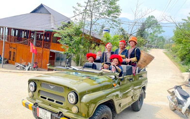 Jeep tour with locals in traditional attire, Sapa, Vietnam.