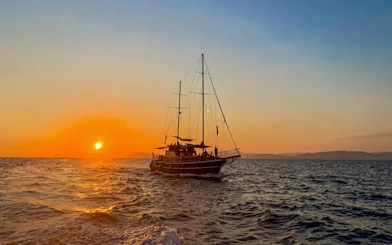 Sunset cruise on Athens Riviera with sailboat, wine, and snacks.