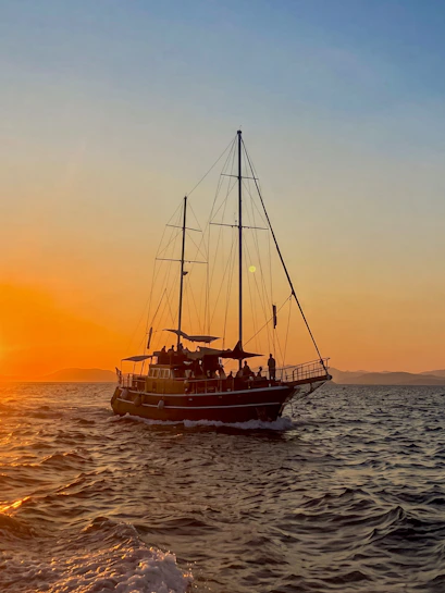 Sunset cruise on Athens Riviera with sailboat, wine, and snacks.