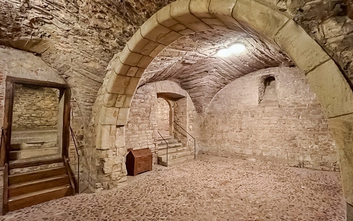 Prague medieval underground stone archway and staircase.
