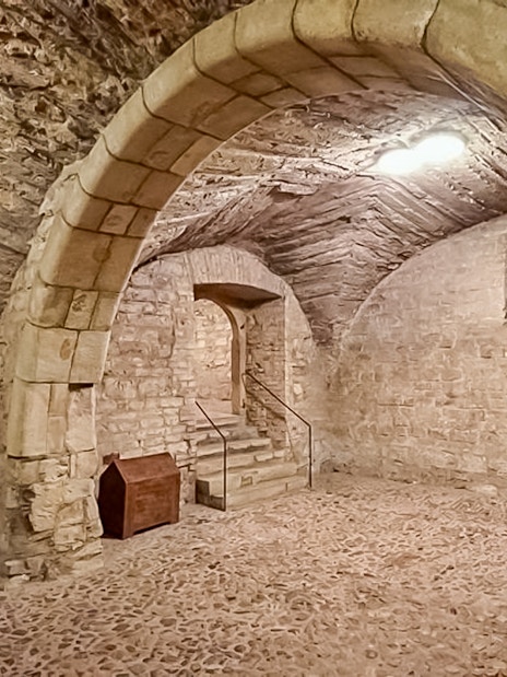 Prague medieval underground stone archway and staircase.