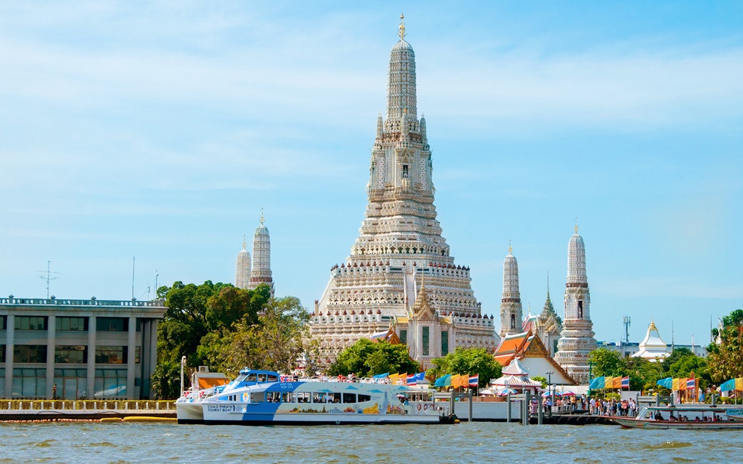 Chao Phraya Tourist Boat near Wat Arun temple in Bangkok, Thailand.