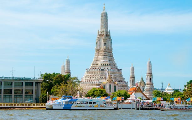 Chao Phraya Tourist Boat near Wat Arun temple in Bangkok, Thailand.
