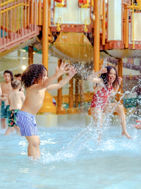 Family enjoying water play at American Dream DreamWorks Water Park.