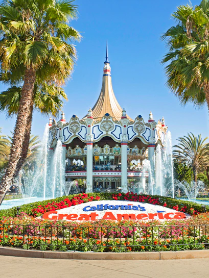 California's Great America entrance with fountains and floral display, Six Flags, California, USA.