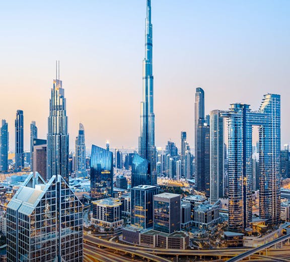 Dubai skyline with Burj Khalifa at sunset.