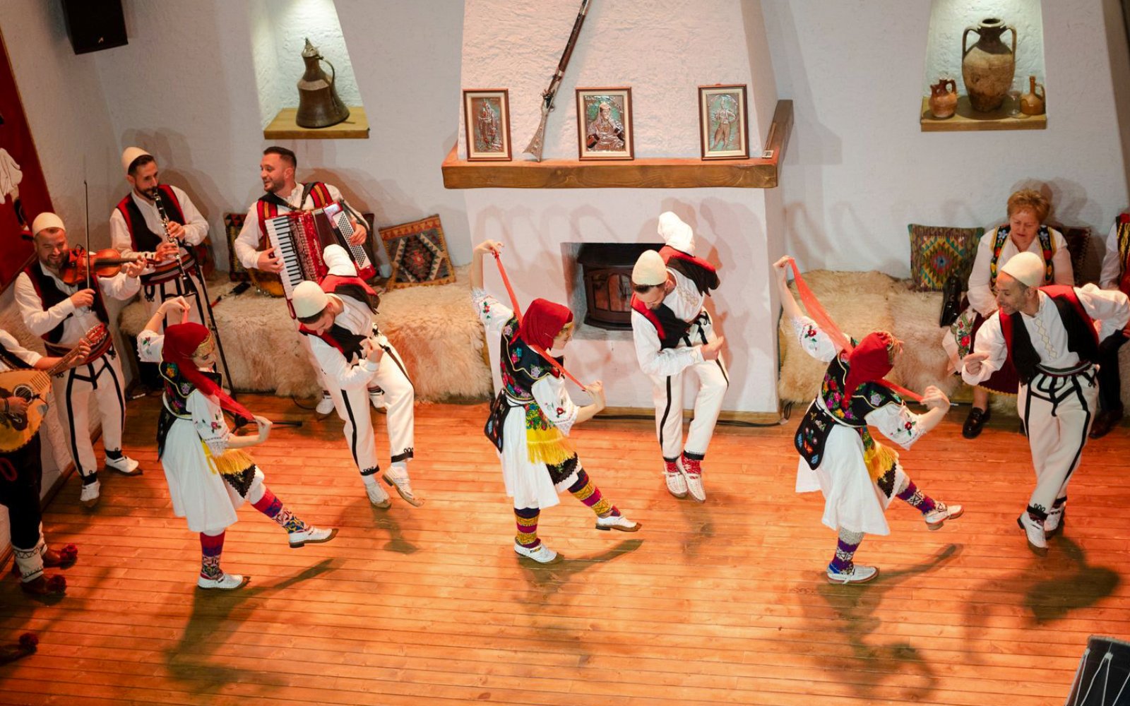 Artists performing traditional dance during Albanian Night Cultural Dance & Music Experience.