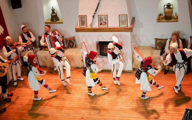 Artists performing traditional dance during Albanian Night Cultural Dance & Music Experience.