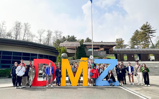 Group of tourists at DMZ sign during Private Korean Demilitarized Zone Day Tour.