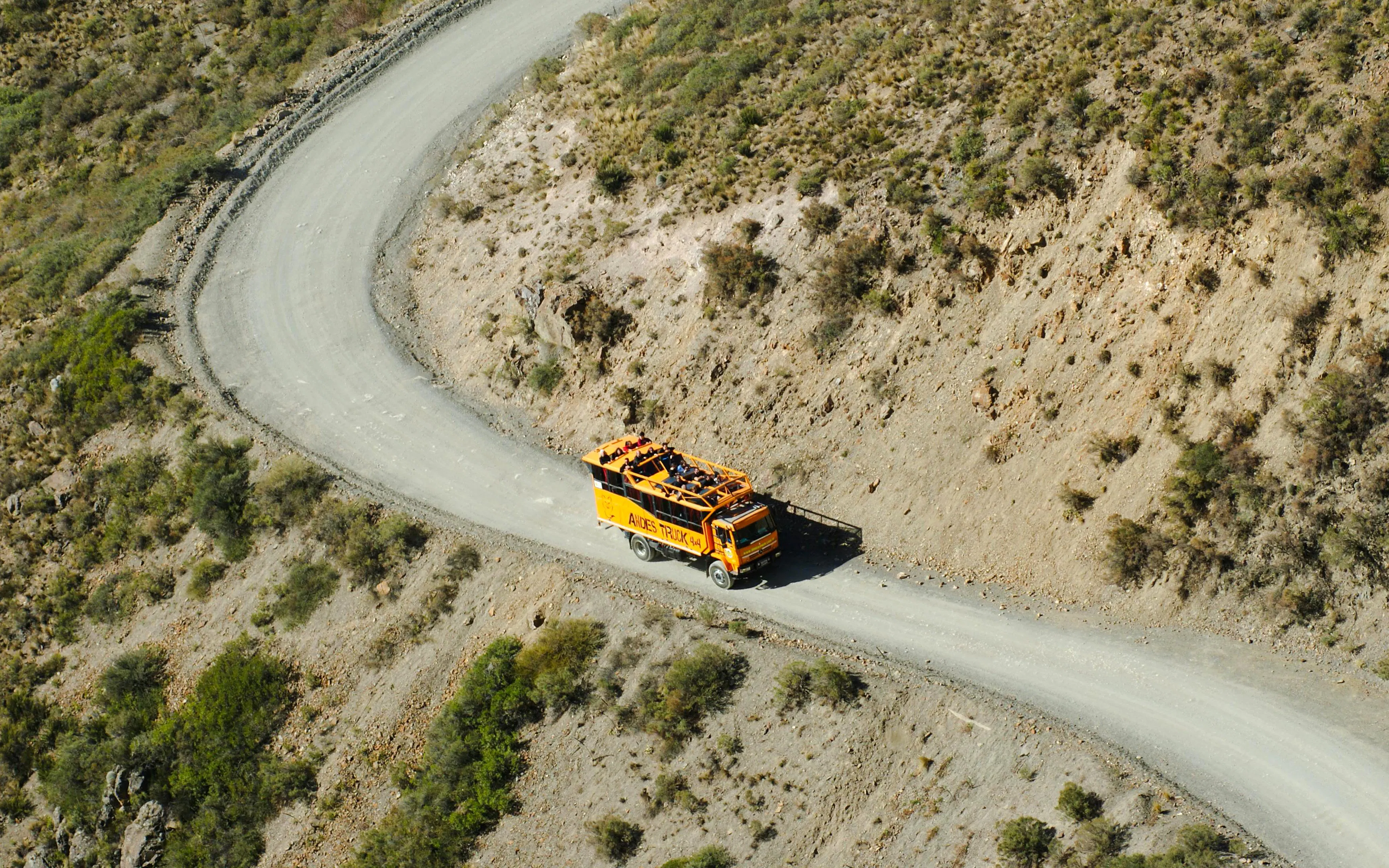 4x4 truck on winding mountain road in Villavicencio Andes tour.