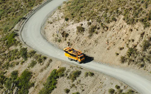4x4 truck on winding mountain road in Villavicencio Andes tour.