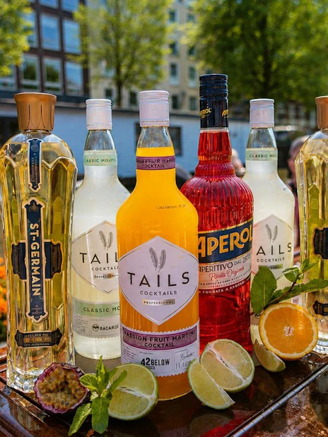 Beverages displayed on a canal cruise boat in Amsterdam with scenic view.