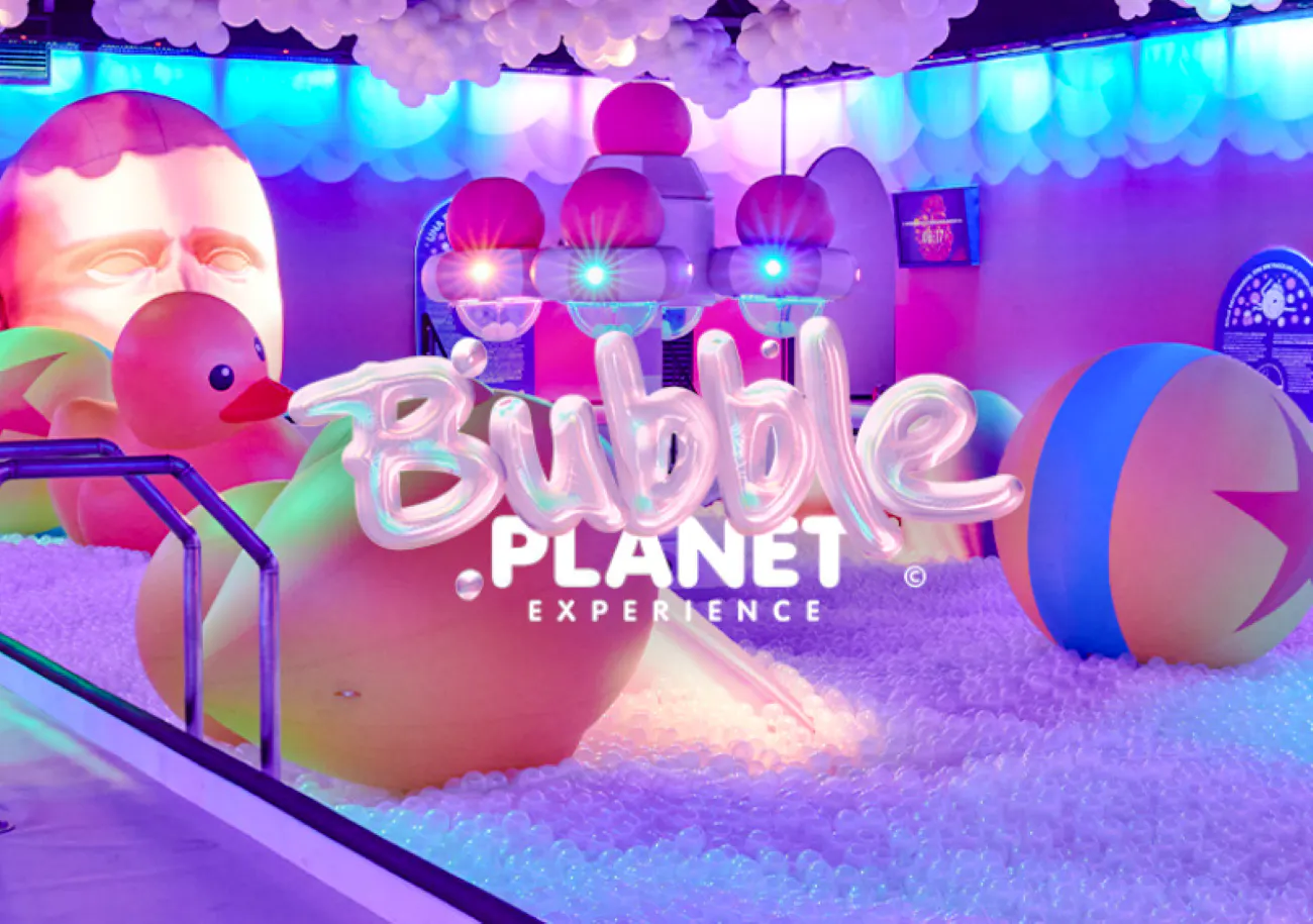 Bubble-themed installation with inflatable ducks and colorful lights at Bubble Planet, Phoenix.