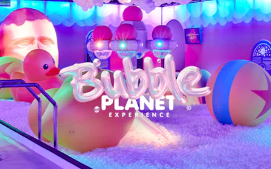 Bubble-themed installation with inflatable ducks and colorful lights at Bubble Planet, Phoenix.