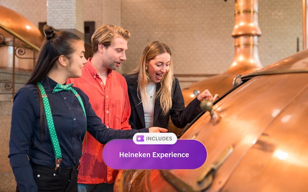 Visitors exploring brewing equipment at Heineken Experience, Amsterdam.