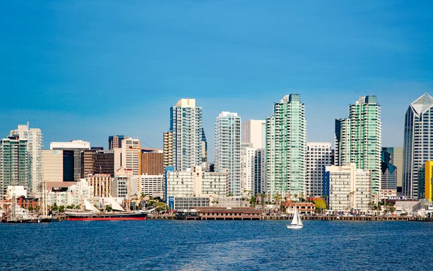 San Diego skyline with sailboats on the bay during Best of the Bay Harbor Tour.
