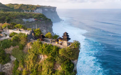 Uluwatu Temple perched on a cliff overlooking the ocean in Bali, Indonesia.