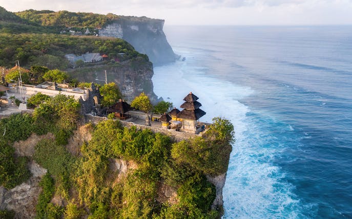 Uluwatu Temple perched on a cliff overlooking the ocean in Bali, Indonesia.