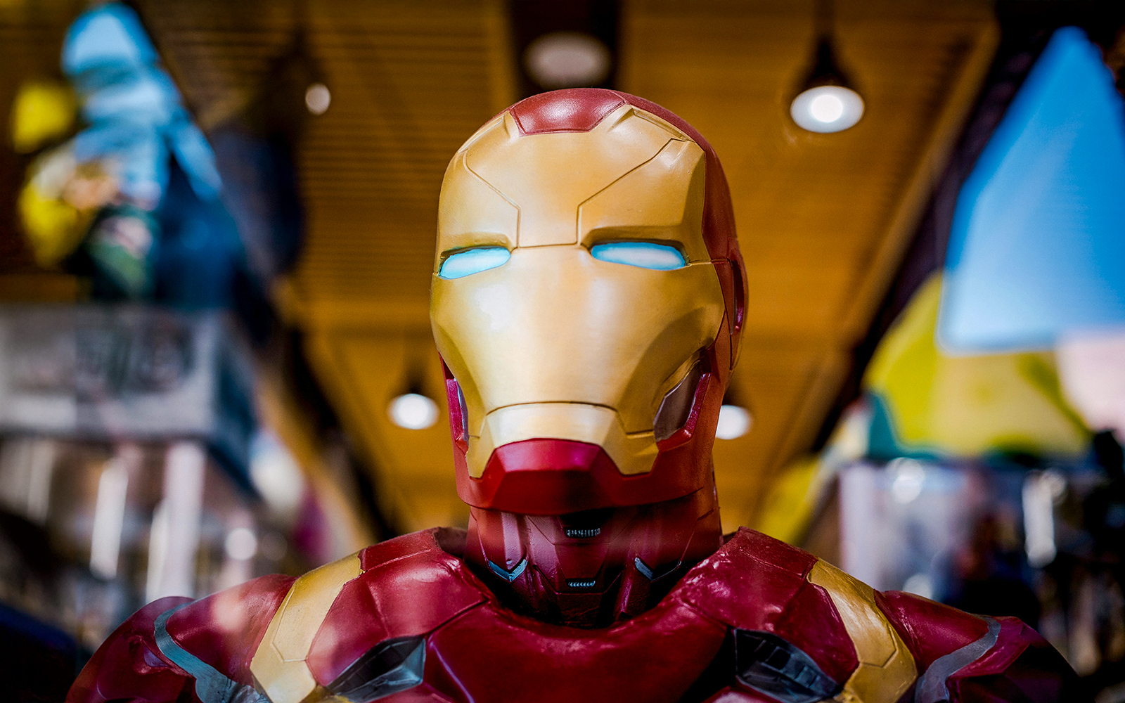 A superhero suit displayed in a museum exhibit.