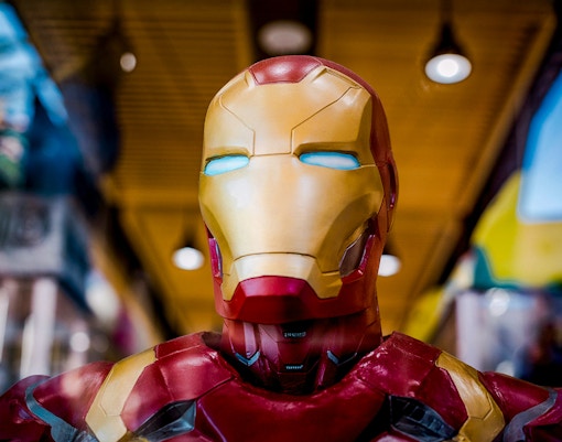 A superhero suit displayed in a museum exhibit.