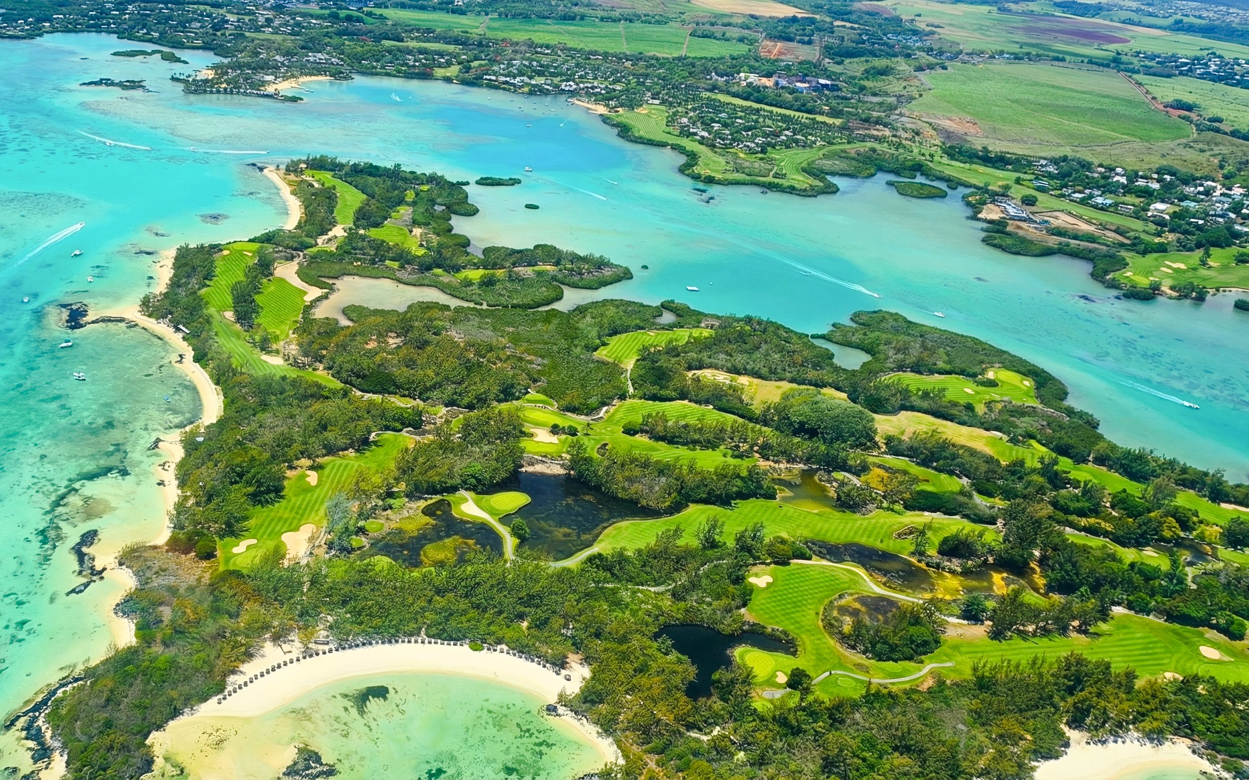 Aerial view of lush coastline and turquoise waters on the Short Amber Route Seaplane Tour, Mauritius.